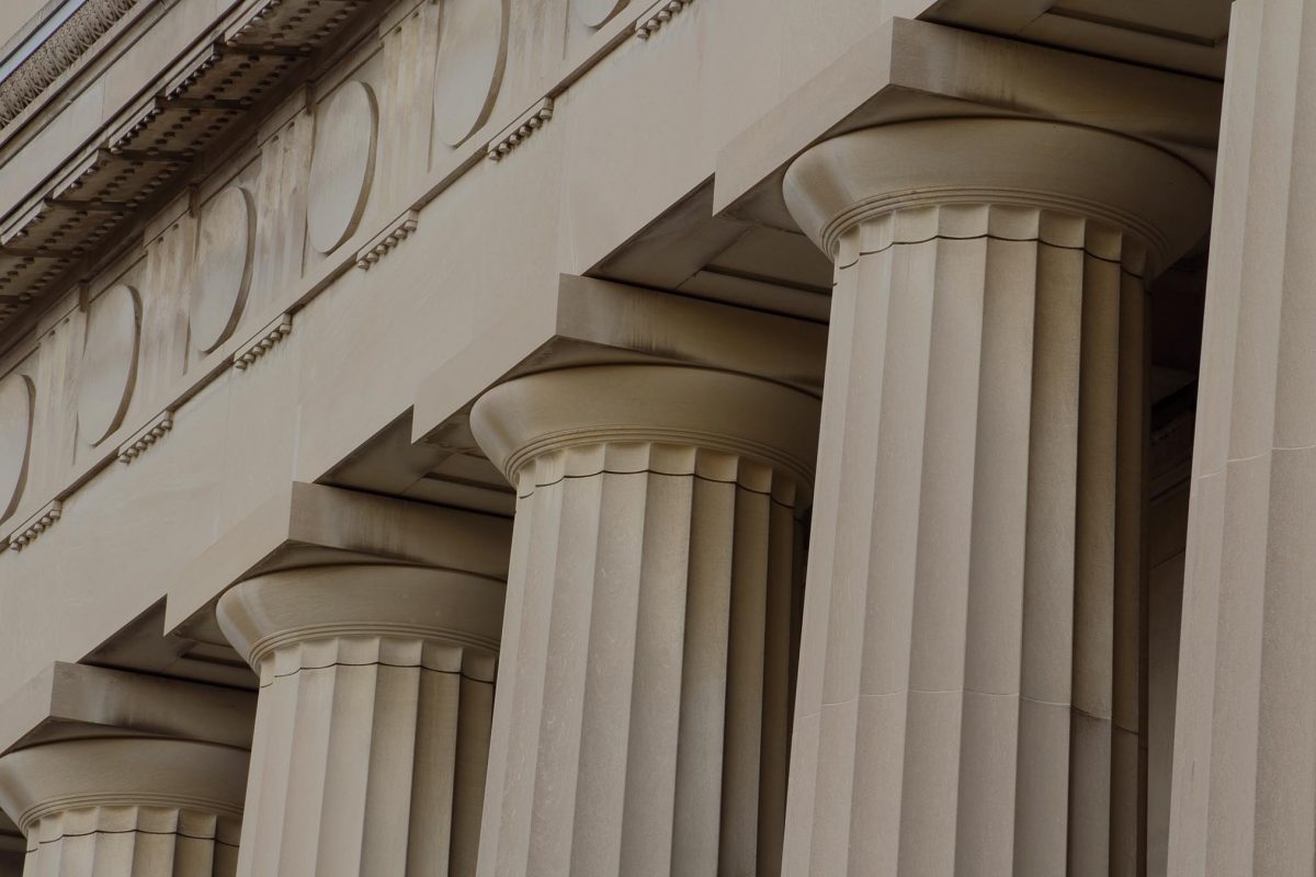 "Detail view of the doric columns featured on the front of James B. Angell Hall at the University of Michigan, Ann Arbor. The architect was Albert Kahn of Detroit. Similar architectural characteristics are often found on banks and courthouses."